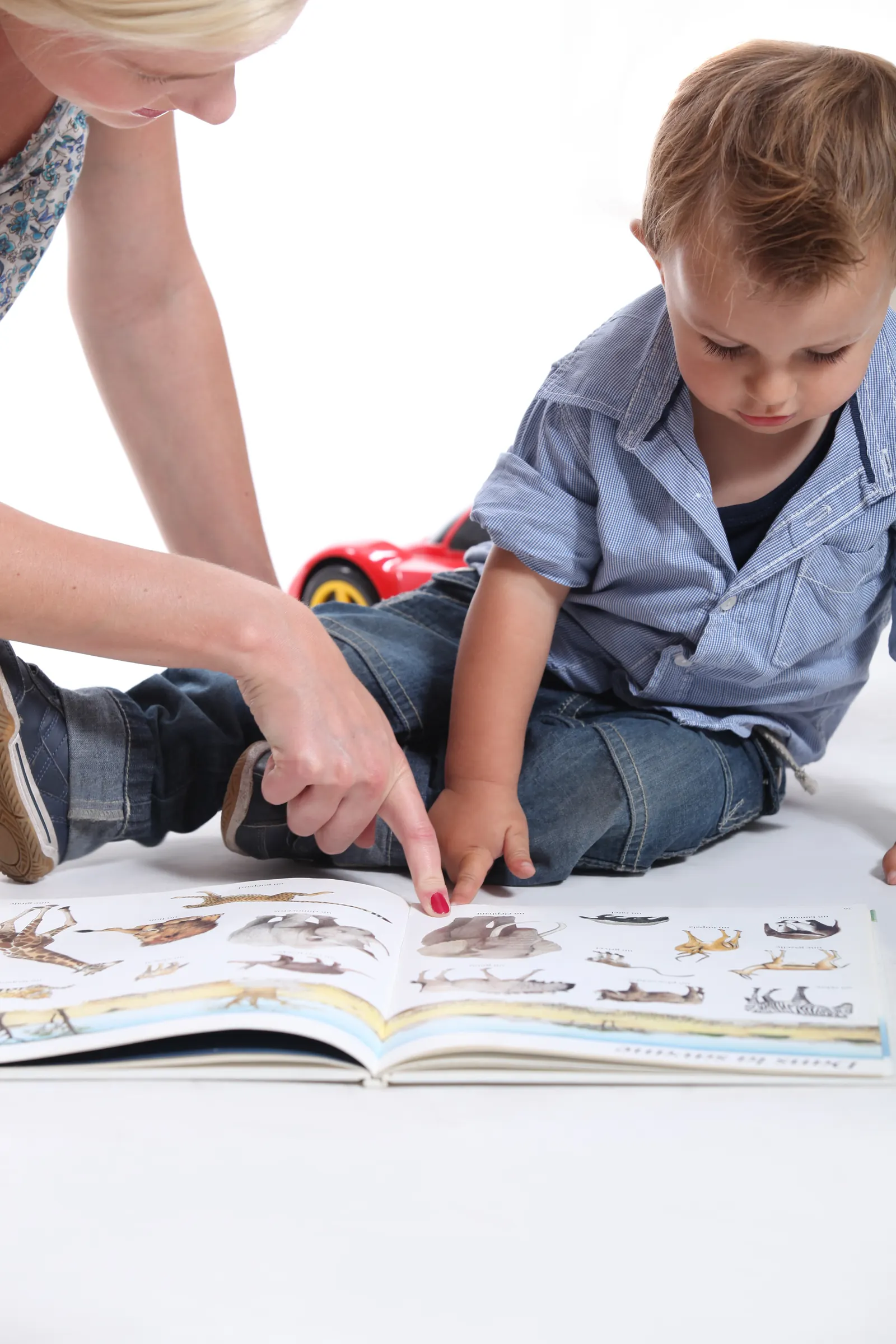 Mother,And,Child,Looking,At,A,Book at Trinity Christian Academy